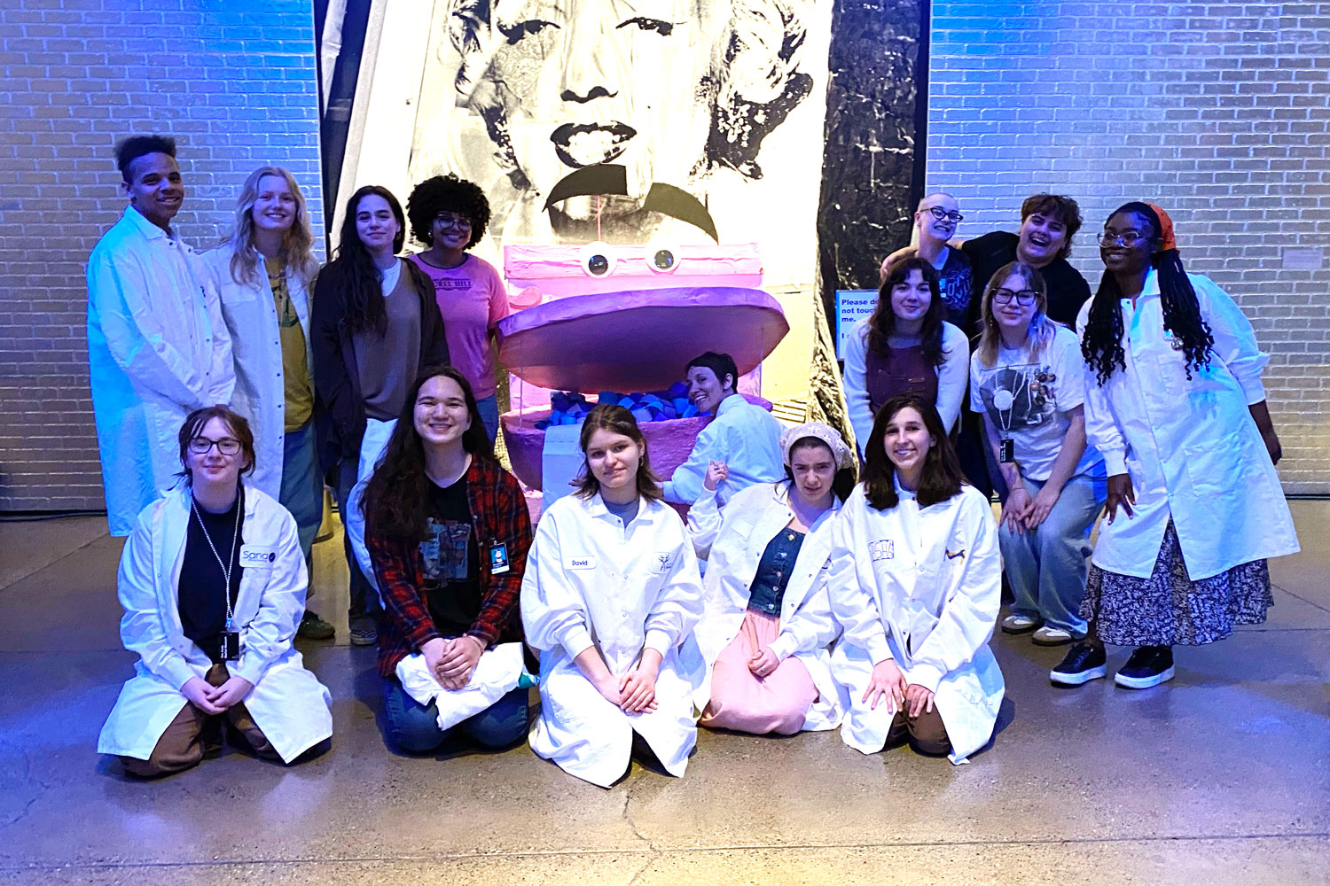 A group of 15 teens , members of Youth Arts Council, posing infront of their decorations during The Warhol‘s Youth Invasion event.